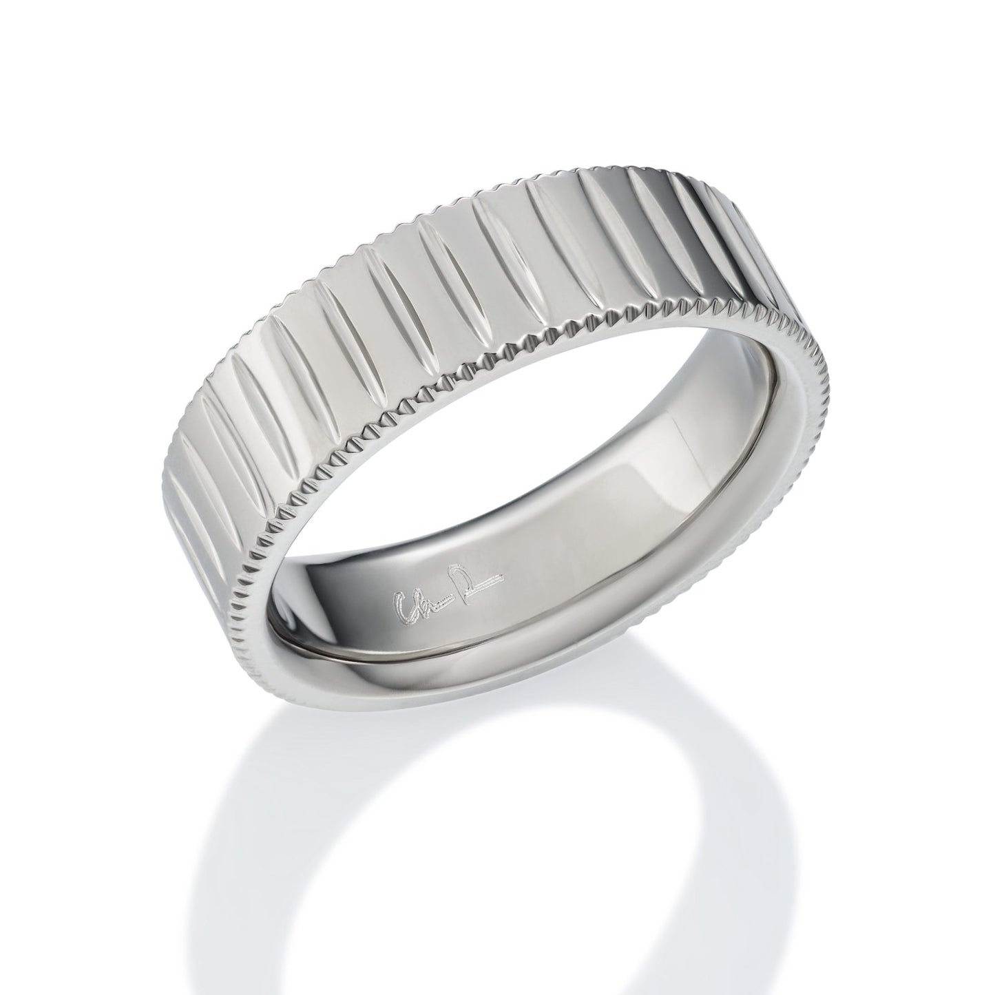 Silver wedding band with a textured, striped pattern on a white background