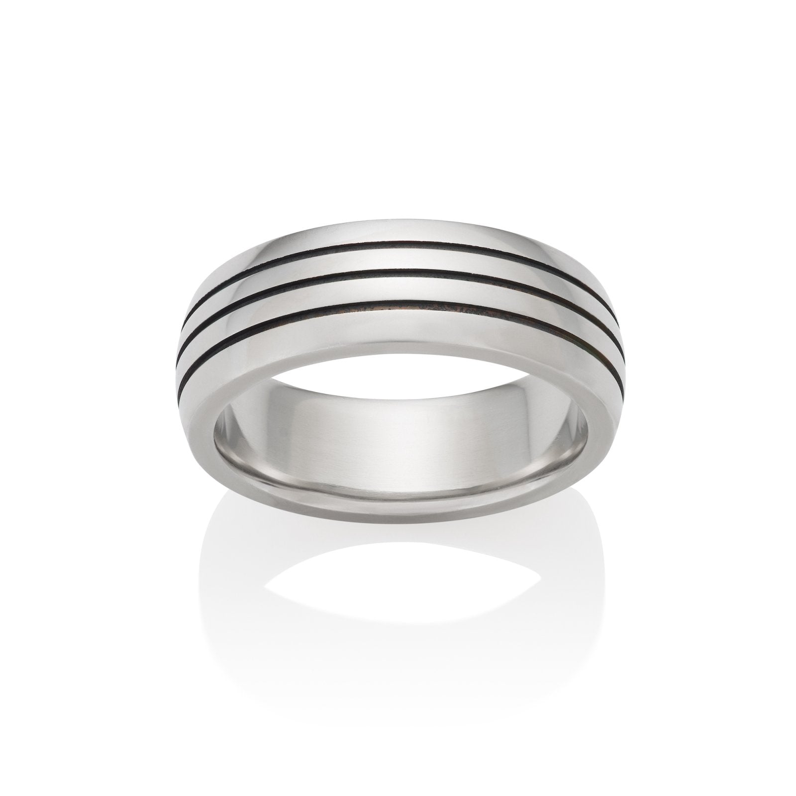 Silver ring with three parallel grooves on the top band, on a white background