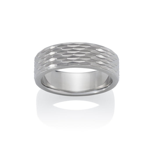 Silver ring with a textured, geometric pattern resembling scales or a honeycomb, on a white background