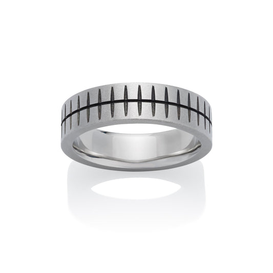 Silver ring with a textured, striped pattern and black accents, on a white background.