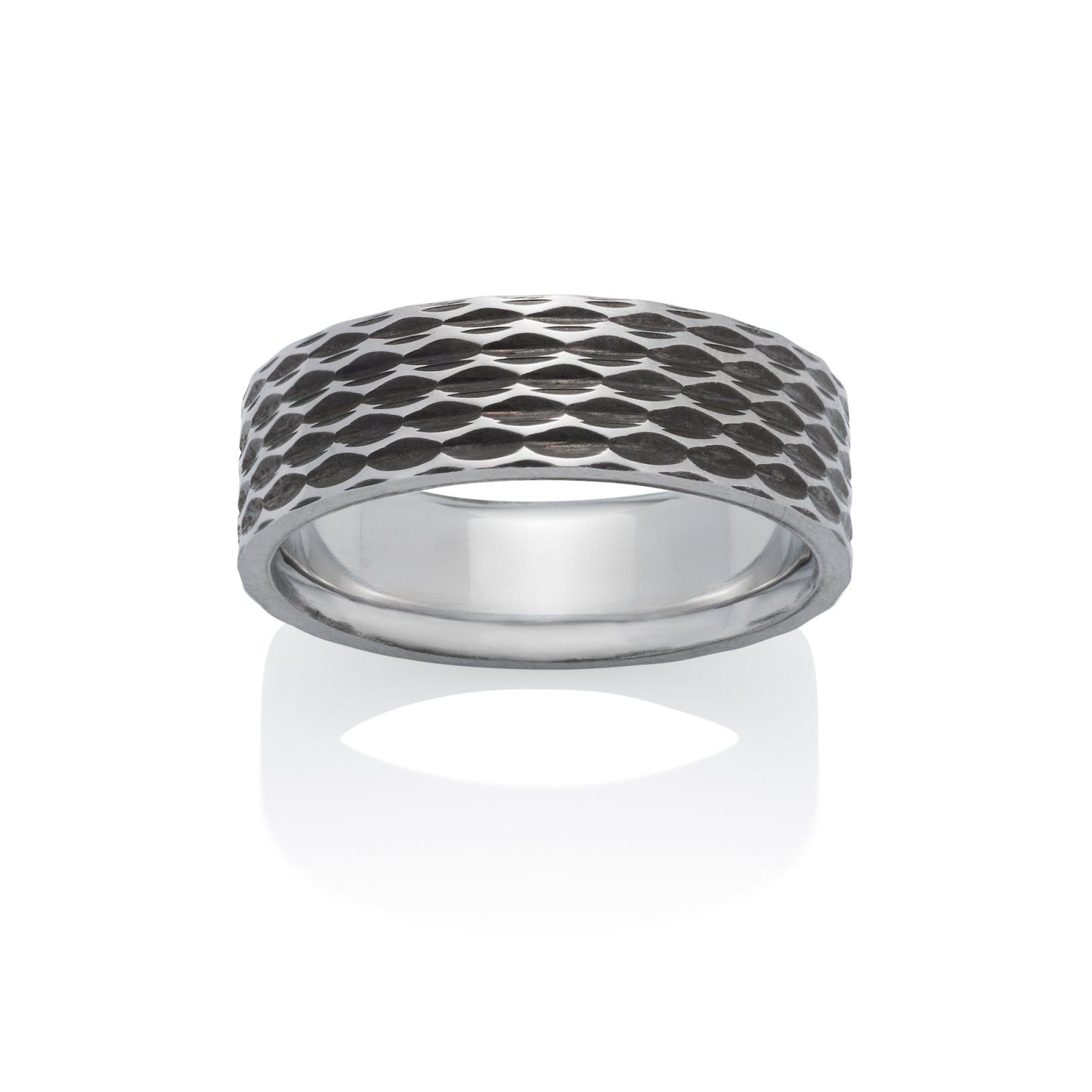 Silver ring with a textured, geometric pattern resembling scales or a honeycomb, on a white background