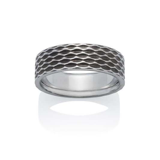 Silver ring with a textured, geometric pattern resembling scales or a honeycomb, on a white background