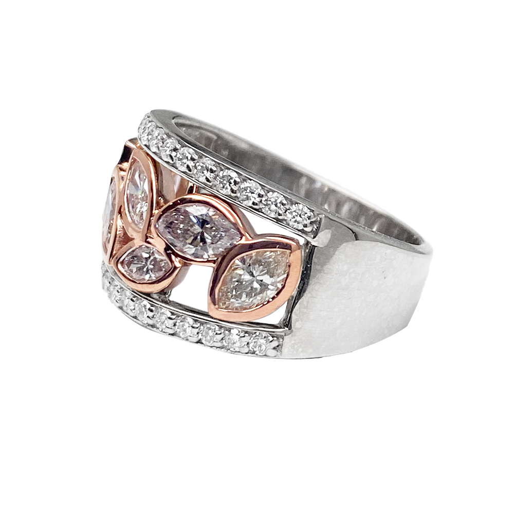 Silver band ring featuring multiple marquise-cut diamonds set in rose gold adorned with smaller diamonds.