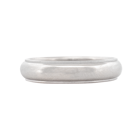 Silver plain band on a white table